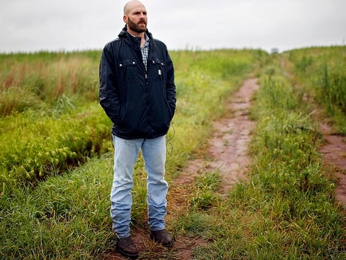 In this July 17, 2014, file photo, Michael Behenna stands on land that he helps work in Medford, Okla. (Sarah Phipps/The Oklahoman via AP, File)