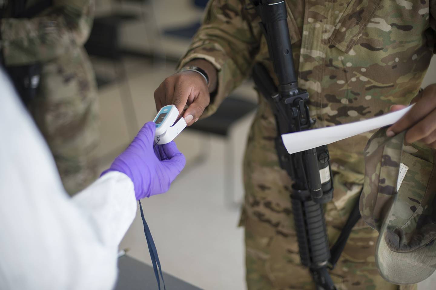 Soldiers attached to the Texas Army National Guard's 36th Infantry Division and 272th Engineer Company receive a COVID-19 IgG, IgM antigen test at Camp Swift in Bastrop, Texas, on June 9, 2020.