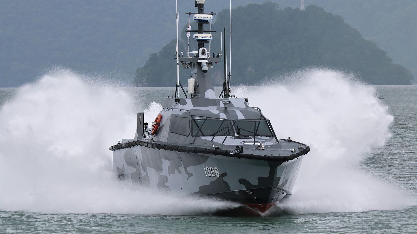 A Fast Interceptor Craft of the Royal Malaysian Navy decelerates rapidly at LIMA 2023. Malaysia has received a second batch of these vessels, which are locally built. (Mike Yeo/Staff)