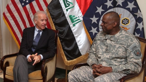 Then-Vice President Joe Biden (L) meets with then Gen. Lloyd Austin, the commander of United States Forces - Iraq at the US embassy upon the former's arrival at Baghdad on a surprise visit on November 29, 2011, during which he is due to meet top Iraqi officials, as American troops depart Iraq ahead of a year-end deadline. (Photo credit should read AHMAD AL-RUBAYE/AFP via Getty Images)