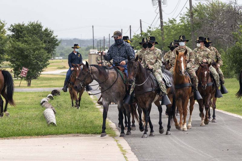 Senior leaders and command teams from 1st Cavalry Division Sustainment Brigade come together in First Team tradition for a trail ride led by the 1st Cavalry Division Horse Detachment, Fort Hood, Texas, July 1, 2020.