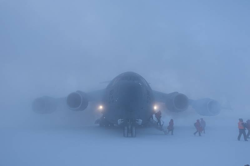 Passengers disembark a U.S. Air Force C-17 Globemaster III, assigned to Joint Base Lewis-McChord, Wash., at McMurdo Station, Antarctica, Sept. 14, 2020.