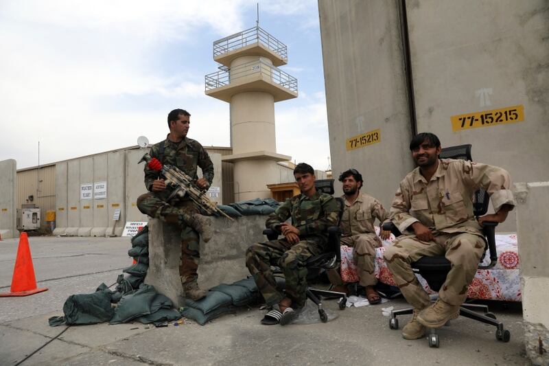 Afghan security forces keep watch after the American military left Bagram air base, in Parwan province north of Kabul, Afghanistan, Monday, July 5, 2021. The U.S. left Afghanistan's Bagram Airfield after nearly 20 years, winding up its 