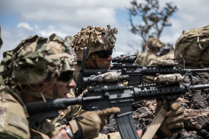 Troopers assigned to 2nd Squadron, 14th Calvary Regiment, 2nd Infantry Brigade Combat Team, 25th Infantry Division provide security during a combined arms live-fire exercise at Pohakuloa Training Area, Hawaii, May 15, 2018. (1st Lt. Ryan DeBooy/Army)