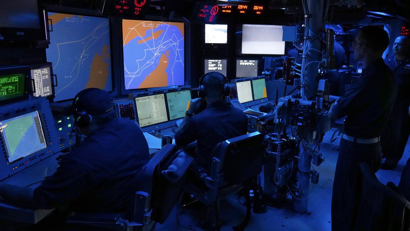 U.S. Navy sailors work in the Combat Information Center of the guided-missile destroyer Paul Hamilton in the Strait of Hormuz Friday, May 19, 2023. (Jon Gambrell/AP)