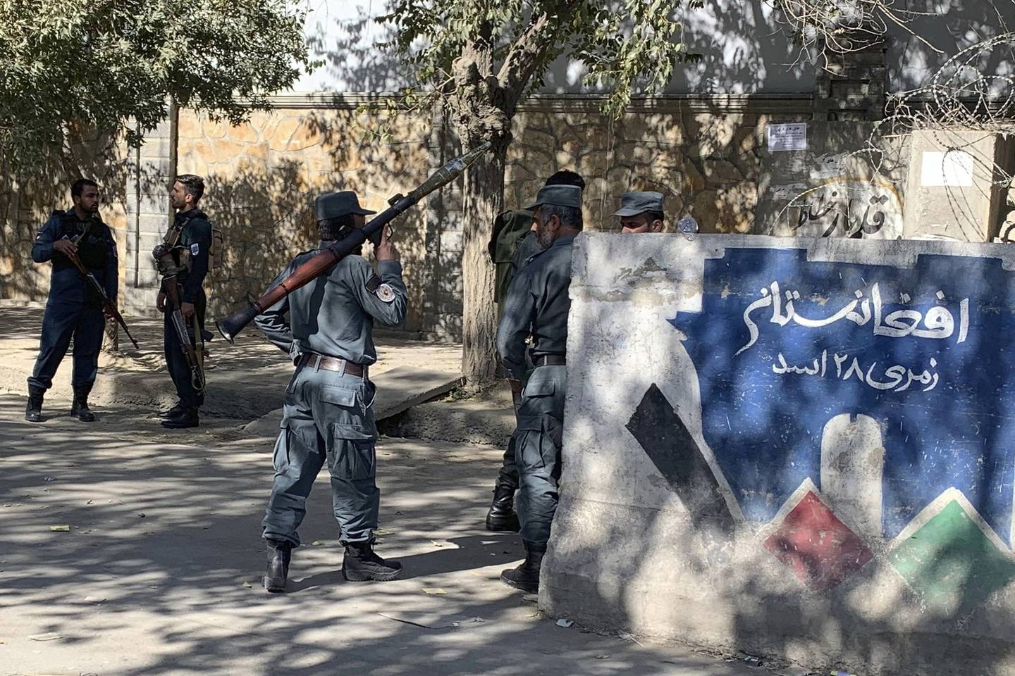 Afghan police arrive at the site of an attack at Kabul University in Kabul, Afghanistan, Monday, Nov. 2, 2020.
