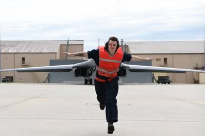 A crew chief from the 28th Aircraft Maintenance Squadron, Ellsworth Air Force Base, S.D., prepares to taxi a B-1B Lancer before an approximately 29-hour long-range, long-duration, strategic bomber mission to the U.S. European Command area of responsibility, May 28, 2020.
