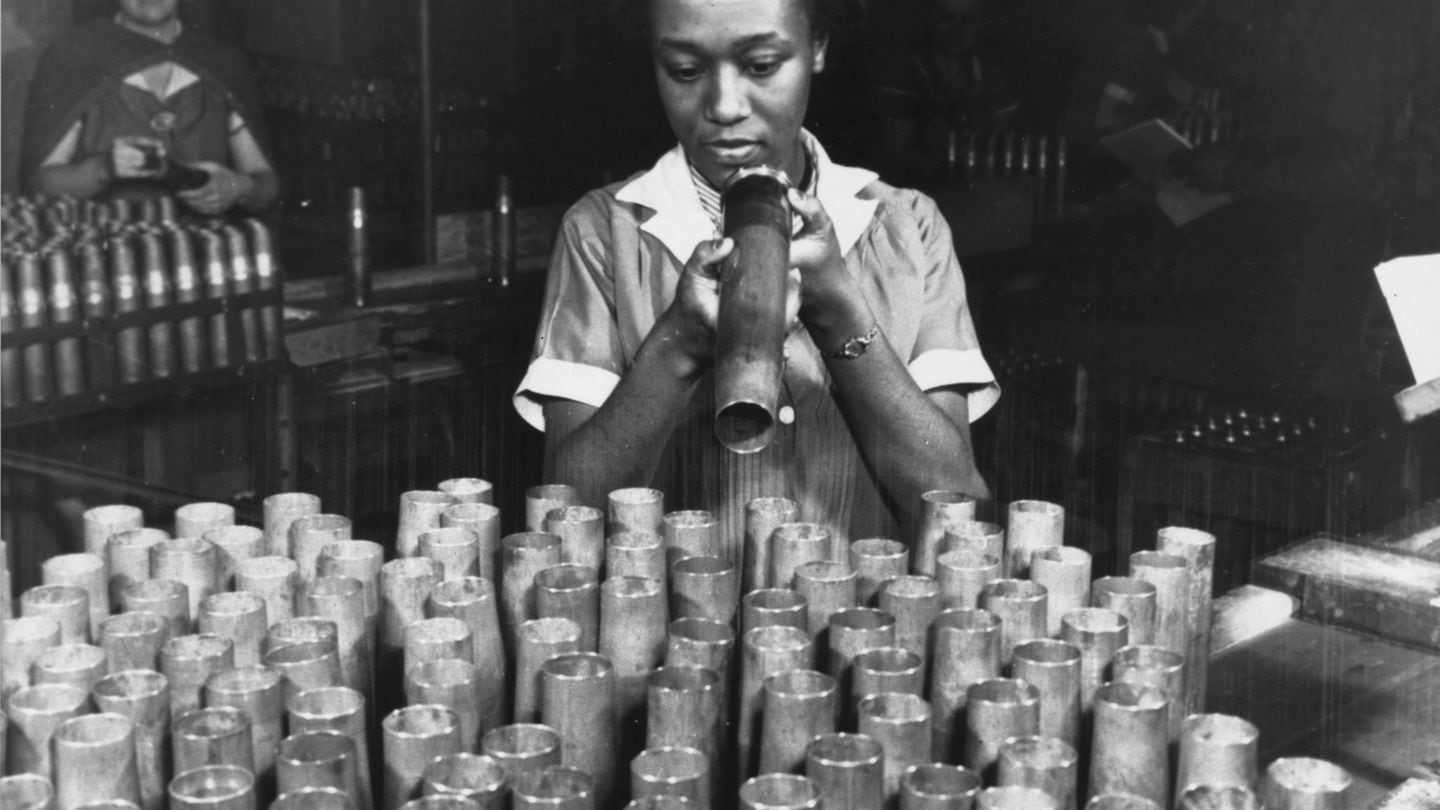 An American works at a munitions factory around 1940. (Hulton Archive/Getty Images)