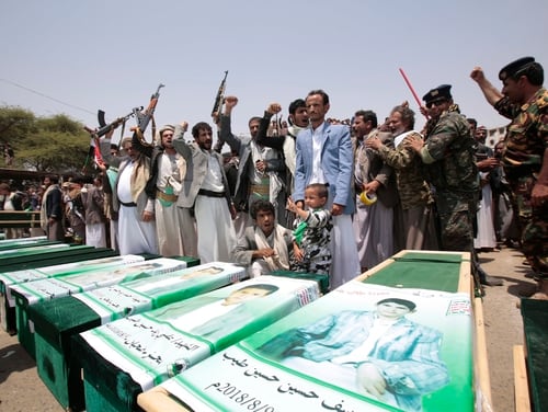 Mourners attend the funeral of victims of a Saudi-led airstrike, in Saada, Yemen, on Aug. 13, 2018. House lawmakers voted on Wednesday to block U.S. military involvement in the war, including assisting Saudi Arabian allies with aircraft refueling and logistics missions. (Hani Mohammed/AP)