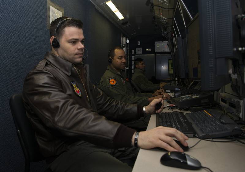 Master Sgt. Mike, 12th Reconnaissance Squadron RQ-4 Global Hawk pilot, and Tech. Sgt. Robert, 12th RS RQ-4 sensor operator, simulate flying operations Feb. 8, 2019, at Beale Air Force Base, California. In 2017 a group of enlisted pilots became the first enlisted pilots since 1942 to fly operational sorties. (Senior Airman Tristan D. Viglianco/Air Force)