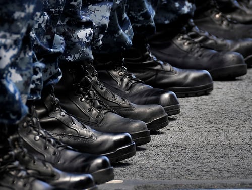 Sailors stand at attention during an awards ceremony aboard the guided-missile cruiser Bunker Hill in 2010, during the mass introduction of new general-purpose safety boots to pair with the Type I “Blueberry” Navy Working Uniform. (Navy)