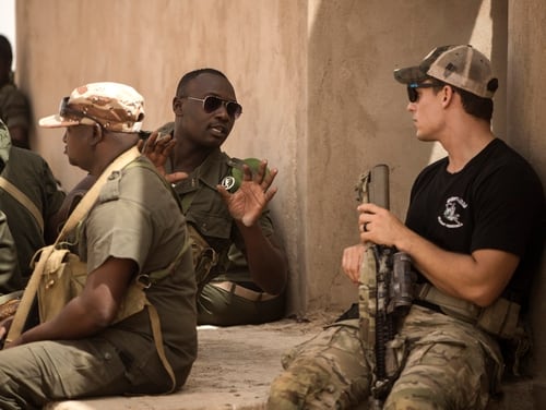 A Nigerien soldier asks a question about urban assault tactics while participating in a special forces training exercise during Exercise Flintlock 2018 in Agadez, Niger, April 14, 2018. (MC3 Evan Parker/Navy)
