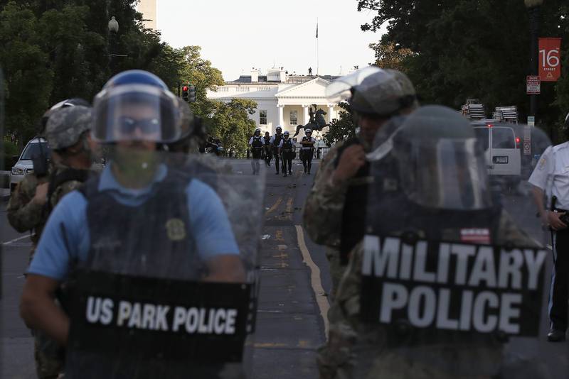 Police clear the area around Lafayette Park and the White House as demonstrators gather to protest the death of George Floyd, Monday, June 1, 2020, in Washington.