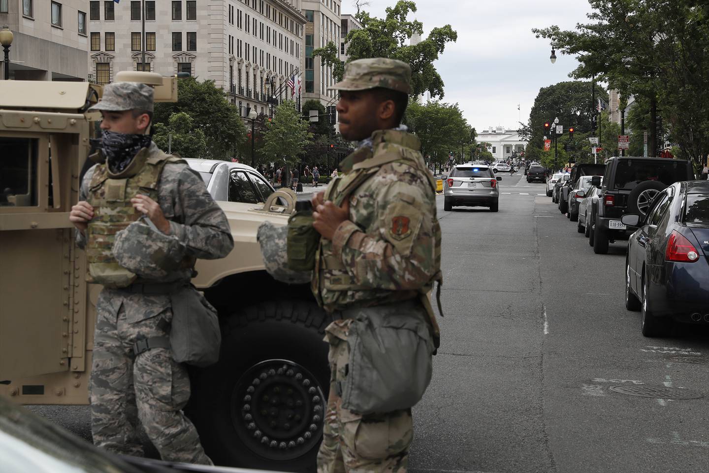 Members of the D.C. National Guard block an intersection on 16th Street as demonstrators gather to protest the death of George Floyd, Tuesday, June 2, 2020, near the White House in Washington.