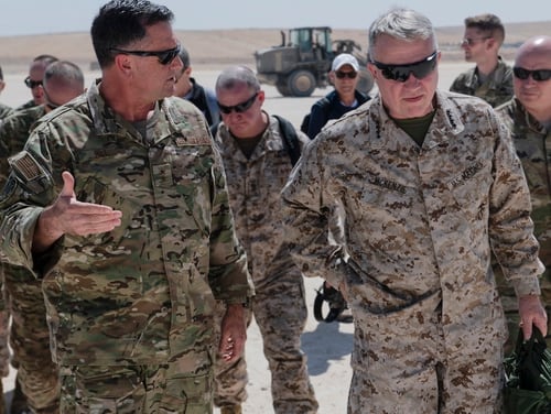 Marine Corps Gen. Frank McKenzie, U.S. Central Command commander, and Air Force Maj. Gen. Eric Hill, Special Operations Joint Task Force – Operation Inherent Resolve commander, discuss the efforts to destroy the remnants of Daesh in Syria July 22, 2019. (Spc. Alec Dionne/Army)