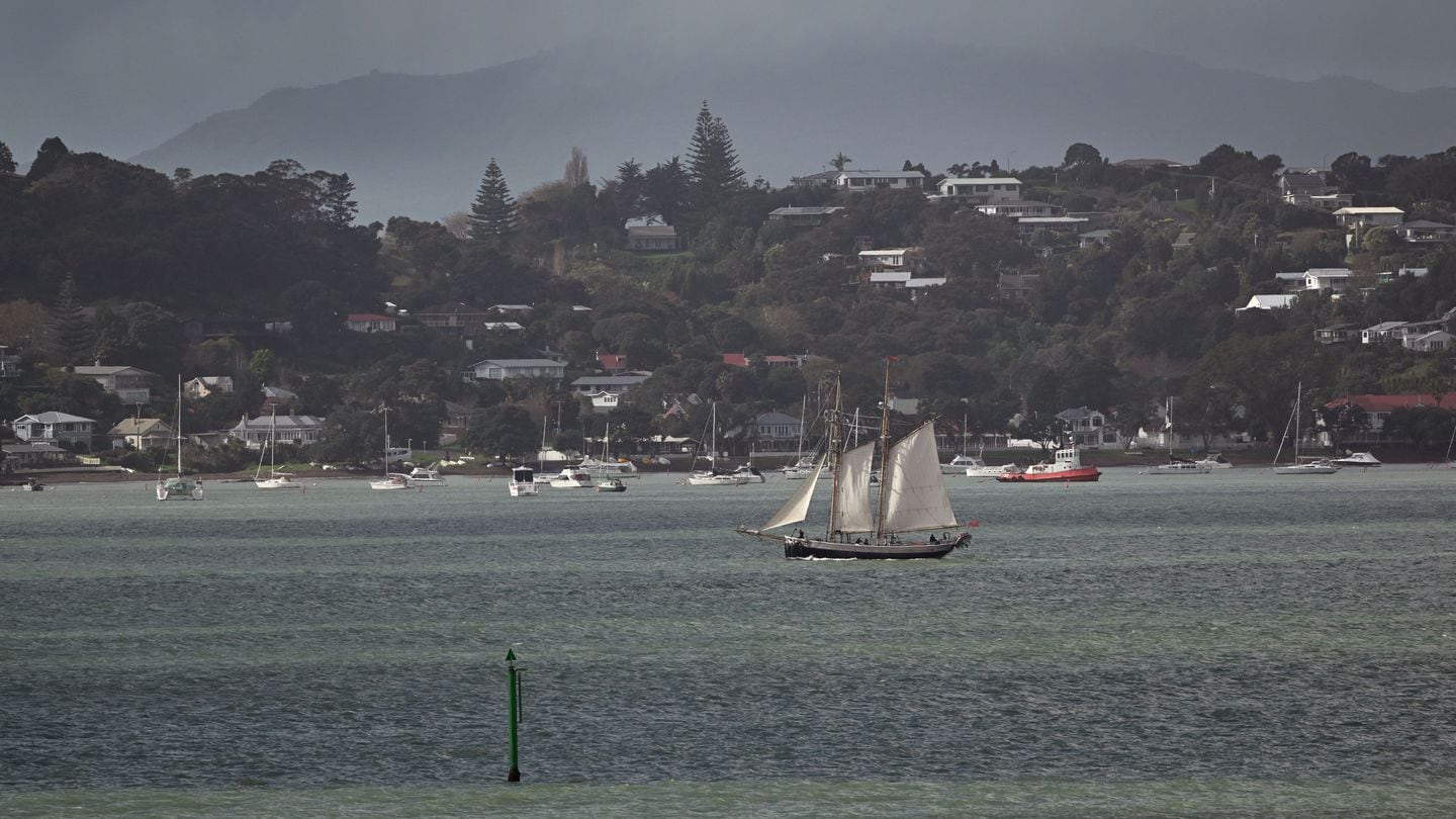A ship passes the historic township of Russell in New Zealand's Bay of Islands on May 29, 2023. (William West/AFP via Getty Images)