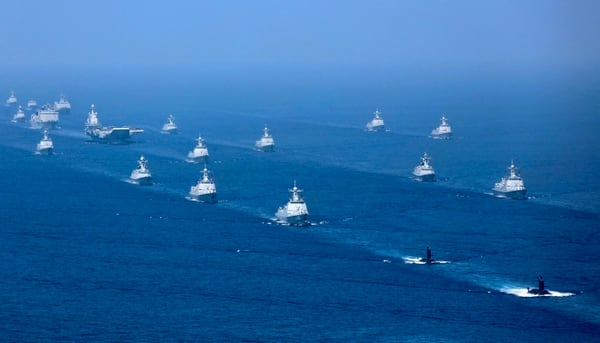 The Liaoning aircraft carrier is accompanied by frigates and submarines on April 12, 2018, conducting exercises in the South China Sea. (Li Gang/Xinhua via AP)
