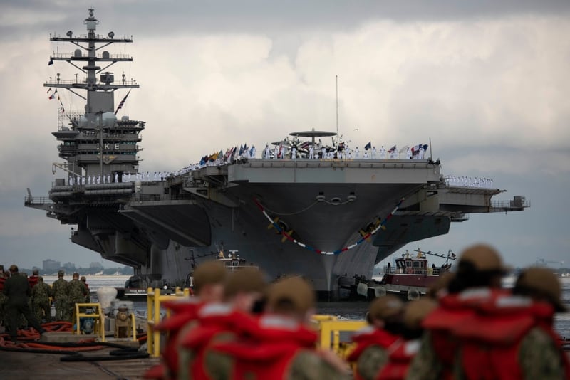 The carrier Dwight D. Eisenhower returns to Naval Station Norfolk in August. Ike is getting ready to leave soon on another deployment. (Navy)