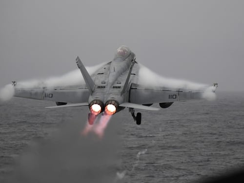 Brrrr! An F/A-18F Super Hornet launches from the aircraft carrier Harry S. Truman Friday in the chilly Norwegian Sea. The carrier is the first of its ilk to enter the Arctic Circle in nearly 30 years. (Navy)