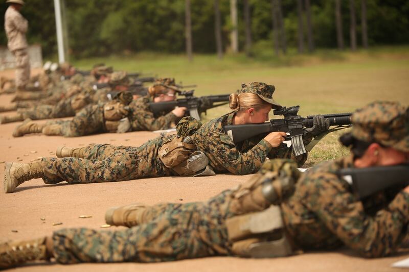 Recruits of November Company, 4th Recruit Training Battalion, fire during rifle marksmanship training May 28, 2014, on Parris Island, S.C. The recruits fired more than 200 rounds each over five days. At the end of the week, they attempted to qualify by shooting from distances of 200, 300 and 500 yards. November Company is scheduled to graduate July 3, 2014. (Parris Island has been the site of Marine Corps recruit training since Nov. 1, 1915. Today, approximately 20,000 recruits come to Parris Island annually for the chance to become United States Marines by enduring 13 weeks of rigorous, transformative training. Parris Island is home to entry-level enlisted training for 50 percent of males and 100 percent of females in the Marine Corps.Photo by Cpl. Octavia Davis)