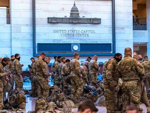 Hundreds of National Guard soldiers stand inside the Capitol Visitor Center to enhance security at the Capitol on January 13, 2021. (J. Scott Applewhite / AP)