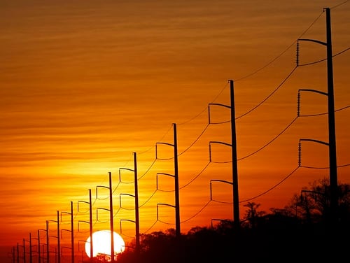 The sun rises beyond power lines in St. Charles Parish, La., on Jan. 31, 2018. Homeland Security officials say that Russian hackers used conventional tools to trick victims into entering passwords in order to build out a sophisticated effort to gain access to control rooms of utilities in the U.S. (Gerald Herbert/AP)