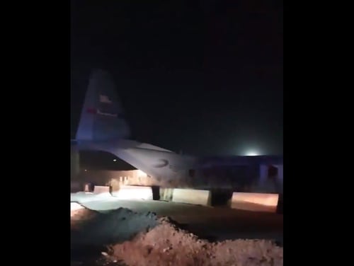 A C-130H Hercules aircraft skidded off the runway at Camp Taji, Iraq, on June 8 and crashed into a wall, injuring four service members and sparking a fire. This screenshot was taken from a video posted on Twitter shortly after the mishap. (Screenshot from Twitter)