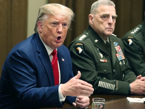 President Donald Trump speaks as Army Gen. Mark Milley, chairman of the Joint Chiefs of Staff, looks on after a briefing from senior military leaders in the Cabinet Room at the White House on Oct. 7, 2019, in Washington. (Mark Wilson/Getty Images)