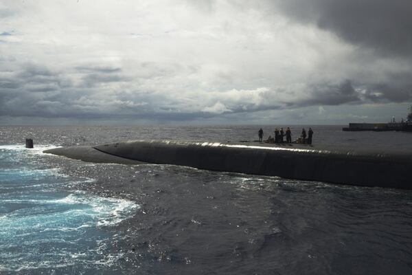 Crew members load supplies on USS Tennessee in the Atlantic Ocean. Exposed data cables in the North Atlantic seem to have caught the eye of Russian submarines in recent months. (Photo by Lt. Joe Painter/U.S. Navy)
