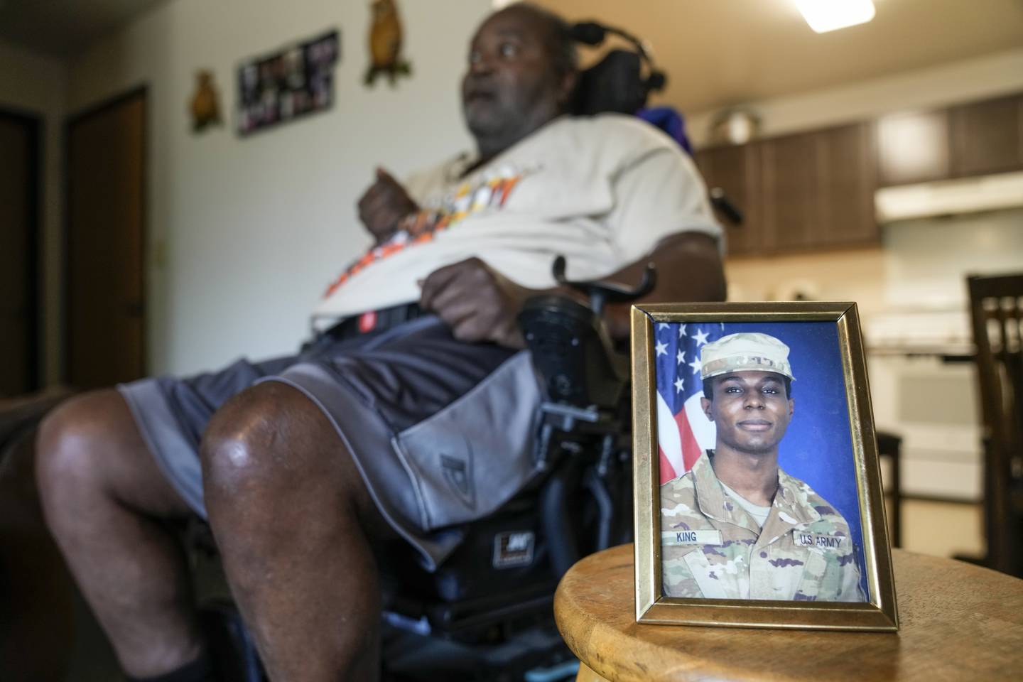 A portrait of American soldier Travis King is displayed as his grandfather, Carl Gates, talks about his grandson Wednesday, July 19, 2023, in Kenosha, Wis