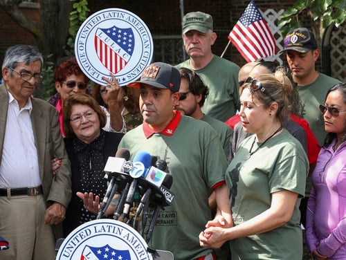 Miguel Perez Jr., center, is surrounded by family and supporters at a news conference in Chicago on Tuesday, Sept. 24, 2019. (Teresa Crawford/AP)