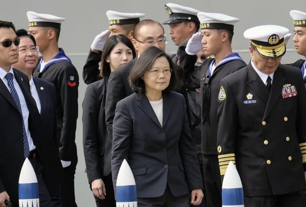 Taiwan President Tsai Ing-wen, center, arrives at the Tsoying navy base in Kaohsiung, southern Taiwan on March 21, 2017. Taiwan formally launched an ambitious project to build its own submarines as the island faces growing military threats from China as relations deteriorate. (Sam Yeh/AFP via Getty Images)
