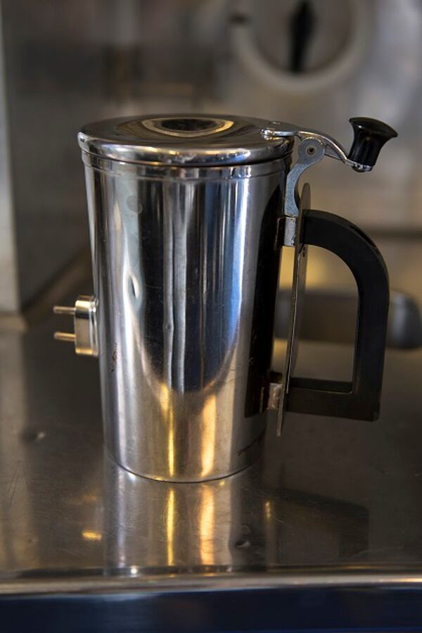 A pricey hot cup sits on a counter inside a KC-10 Extender at Travis Air Force Base, Calif. The base is working on developing a new handle for the cup, which could save the Air Force thousands. (Tech. Sgt. James Hodgman/Air Force)