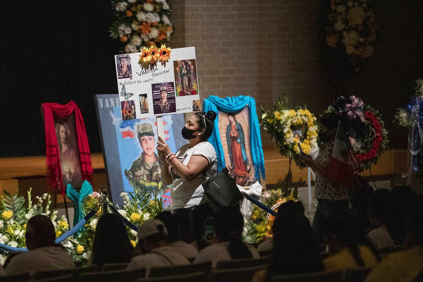 Rosa Samaniego holds a sign demanding justice for Spc. Vanessa Guillen at a memorial service in honor of the soldier on Friday, Aug. 14, 2020, in Houston.