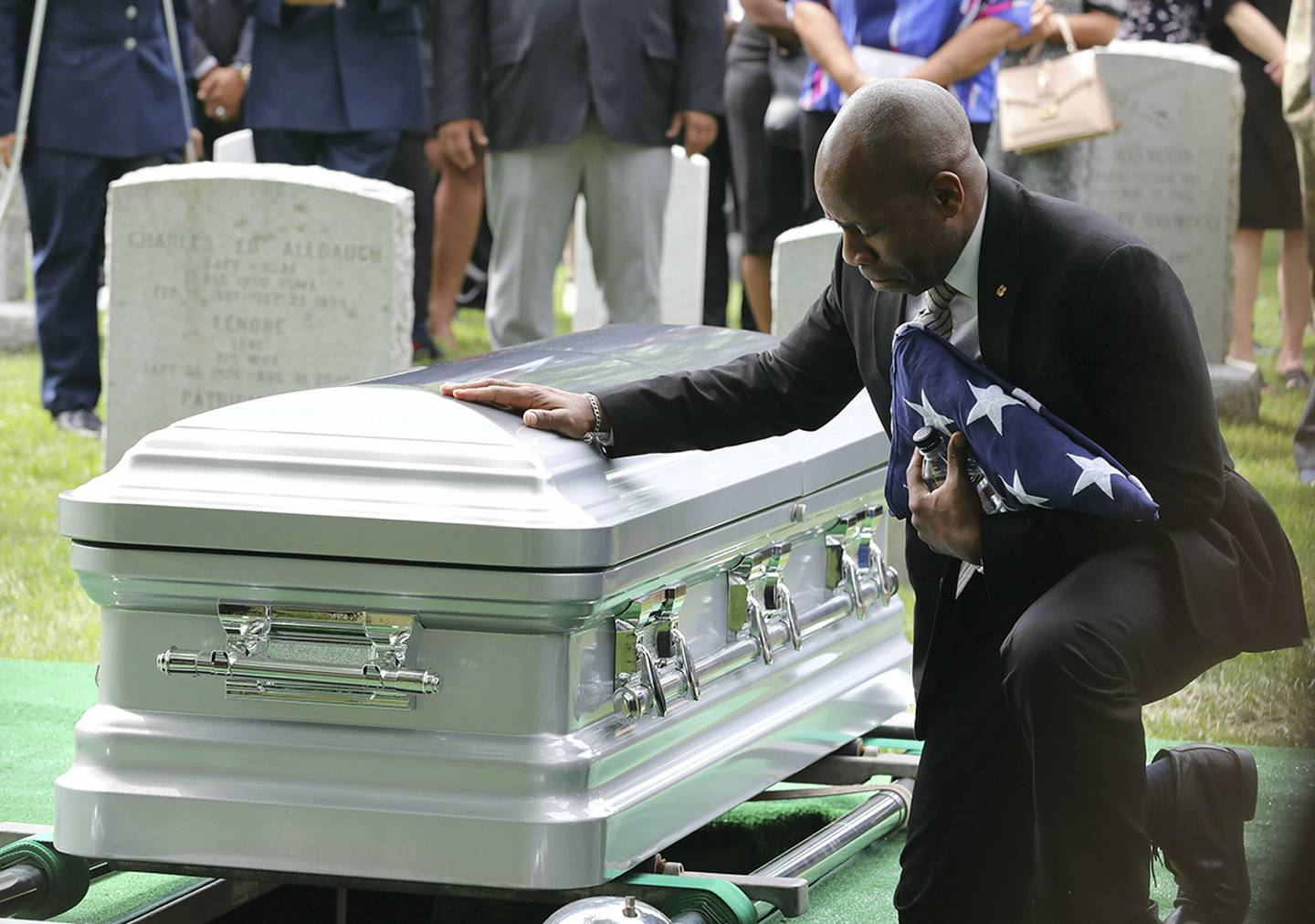 Christopher C. Morgan touches the casket of his son, West Point Cadet Christopher J. Morgan, during the interment ceremony at West Point, N.Y