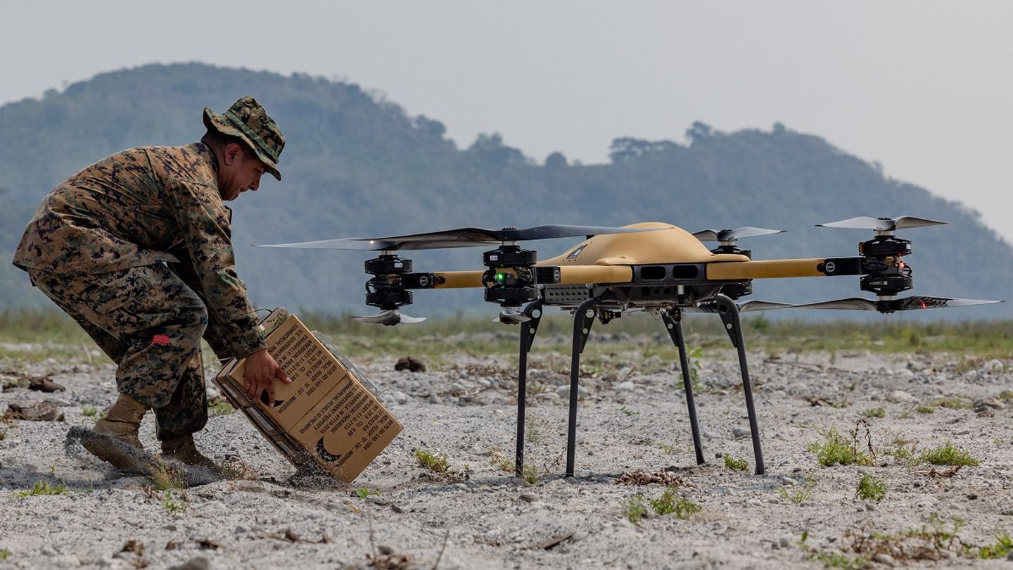 Cpl. Mark Bernal, a landing support specialist with 3d Littoral Logistics Battalion, 3d Marine Littoral Regiment, 3d Marine Division, receives a package from a TRV-50 Tactical Resupply Unmanned Aircraft System as it lands to resupply U.S. Marines in the field during Balikatan 23 in Cerab, Philippines, April 21, 2023. (Cpl. Tyler Andrews/Marine Corps)