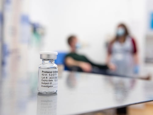 A vial of coronavirus vaccine developed by AstraZeneca and Oxford University in England sits in a research lab in this undated photo. (John Cairns/AP)
