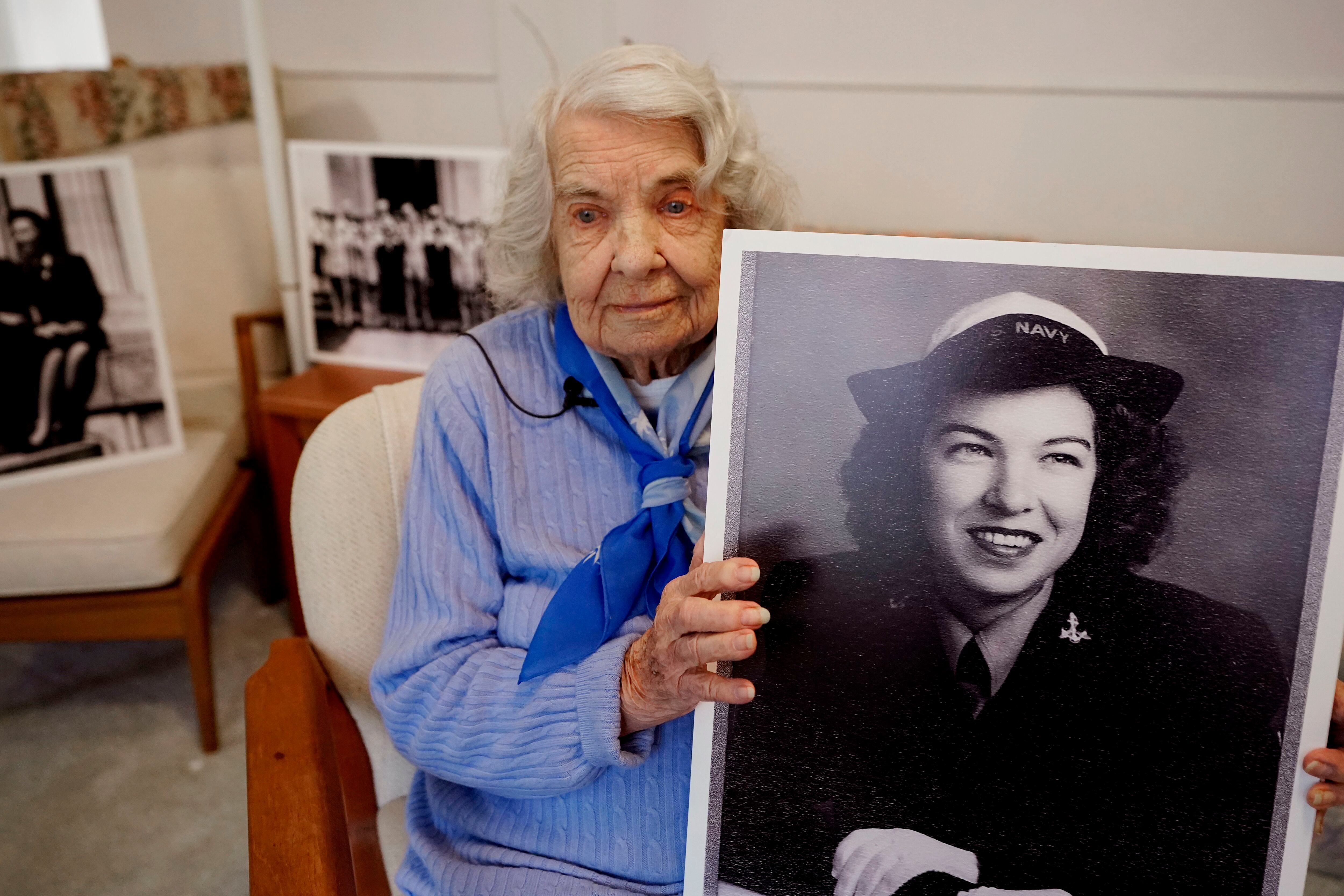 World War II veteran Ethel (Cricket) Poland holds a photo of her younger self during an interview, Monday, April 4, 2022, in Oakland Township, Mich. (Carlos Osorio/AP)