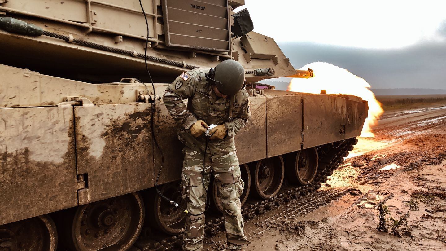 U.S. Army Sgt. Ryan Duginski performs a tank remote-fire procedure to ensure firing capabilities function at Bemowo Piskie Training Area, Poland. (1st Lt. Christina Shoptaw/U.S. Army)