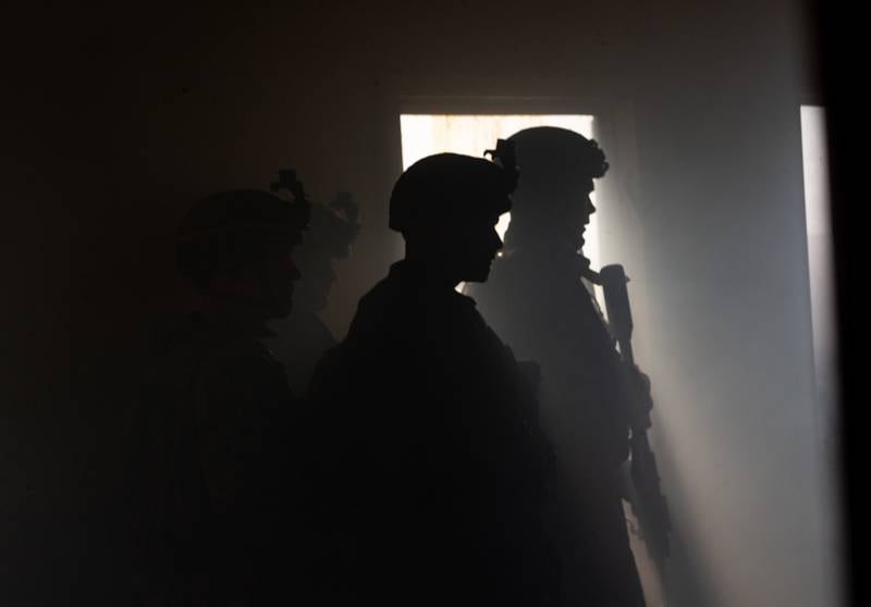 U.S. Marines with 3rd Battalion, 6th Marine Regiment (3/6), 2d Marine Division pass word in a cleared building during Exercise Deep Water on Camp Lejeune, N.C., Aug. 1, 2020.
