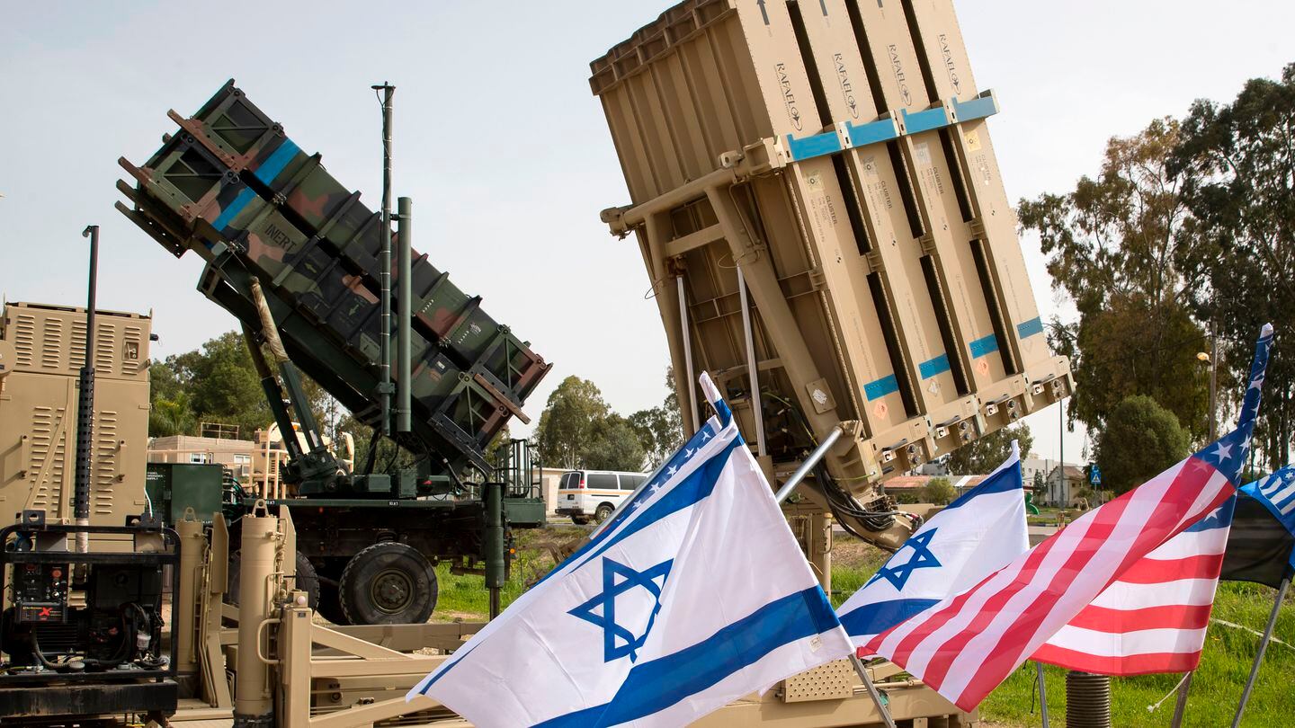 An Israeli Iron Dome system, right, and an U.S. Patriot weapon are shown during the joint military exercise Juniper Cobra at the Hatzor air base in 2018. Jack Guez/AFP via Getty Images)