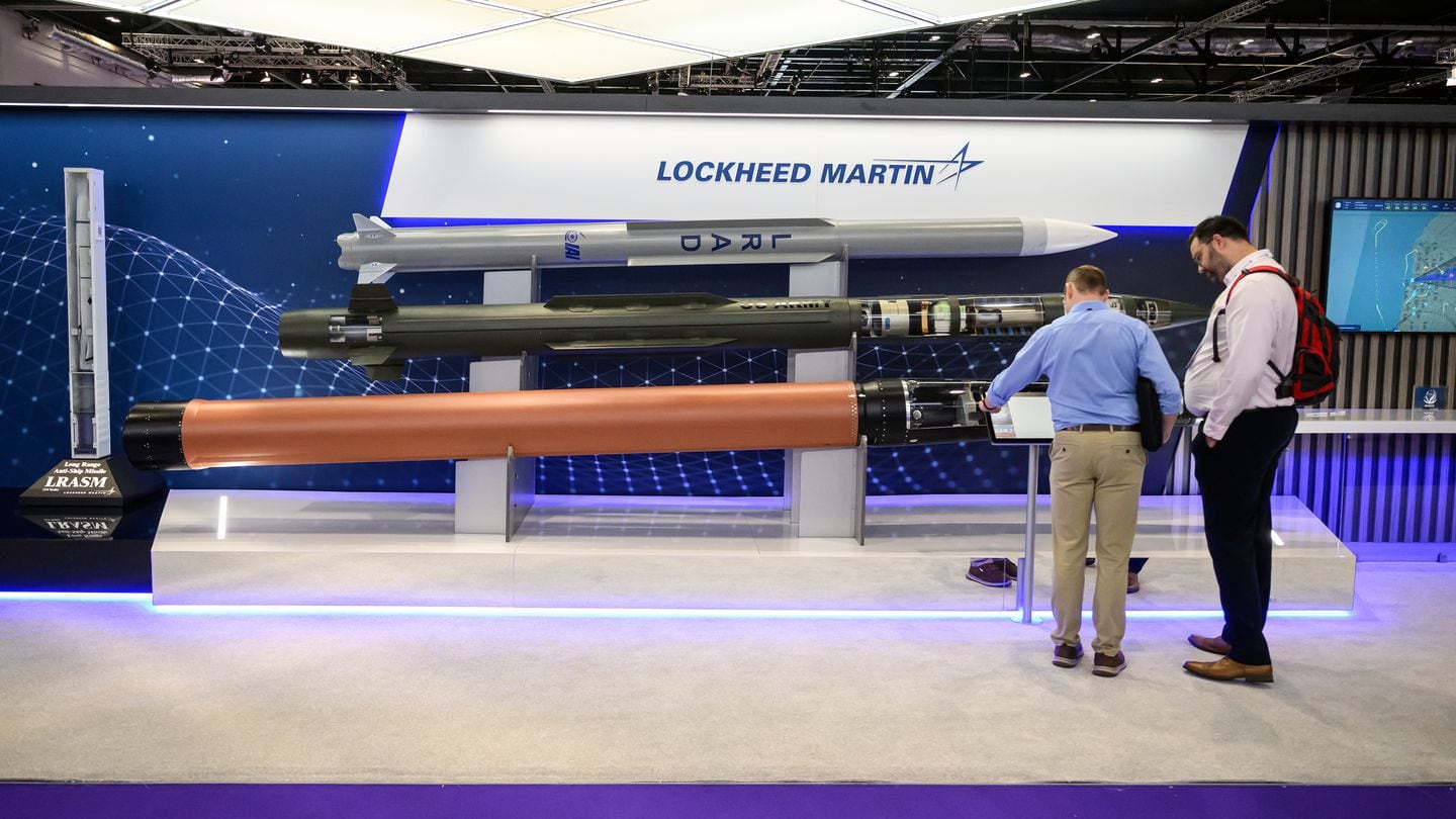 From top, visitors look at the Barak, PAC-3 MSE and THAAD missiles from Lockheed Martin at the DSEI show in London on Sept. 12, 2023. (Leon Neal/Getty Images)