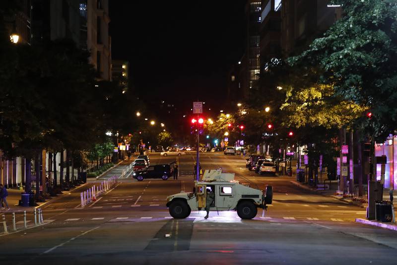A military Humvee blocks an intersection along K Street in downtown Washington as demonstrators protest the death of George Floyd, Monday, June 1, 2020, in Washington.