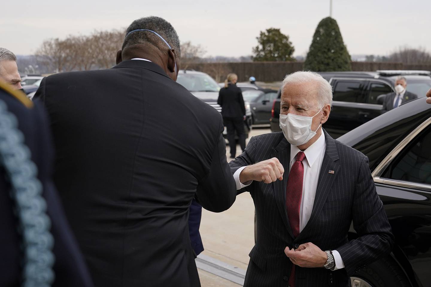 President Joe Biden elbow bumps Defense Secretary Lloyd Austin as he arrives at the Pentagon, Wednesday, Feb. 10, 2021, in Washington.