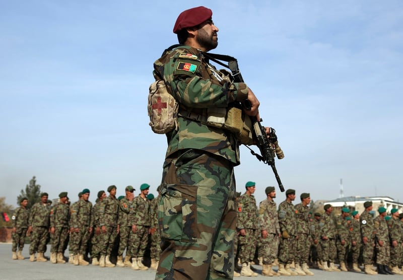 A national army forces stands guard during the graduation ceremony of newly Afghan National Army soldiers after a three month training program at the Afghan Military Academy in Kabul, Afghanistan, on Oct. 28, 2019. (Rahmat Gul/AP)