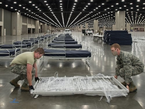 More than 30 members of the Kentucky Air National Guard’s 123rd Civil Engineer Squadron set up hospital beds and clinical space at the Kentucky Fair and Exposition Center in Louisville, Ky., April 13, 2020. (Dale Greer/Air National Guard)