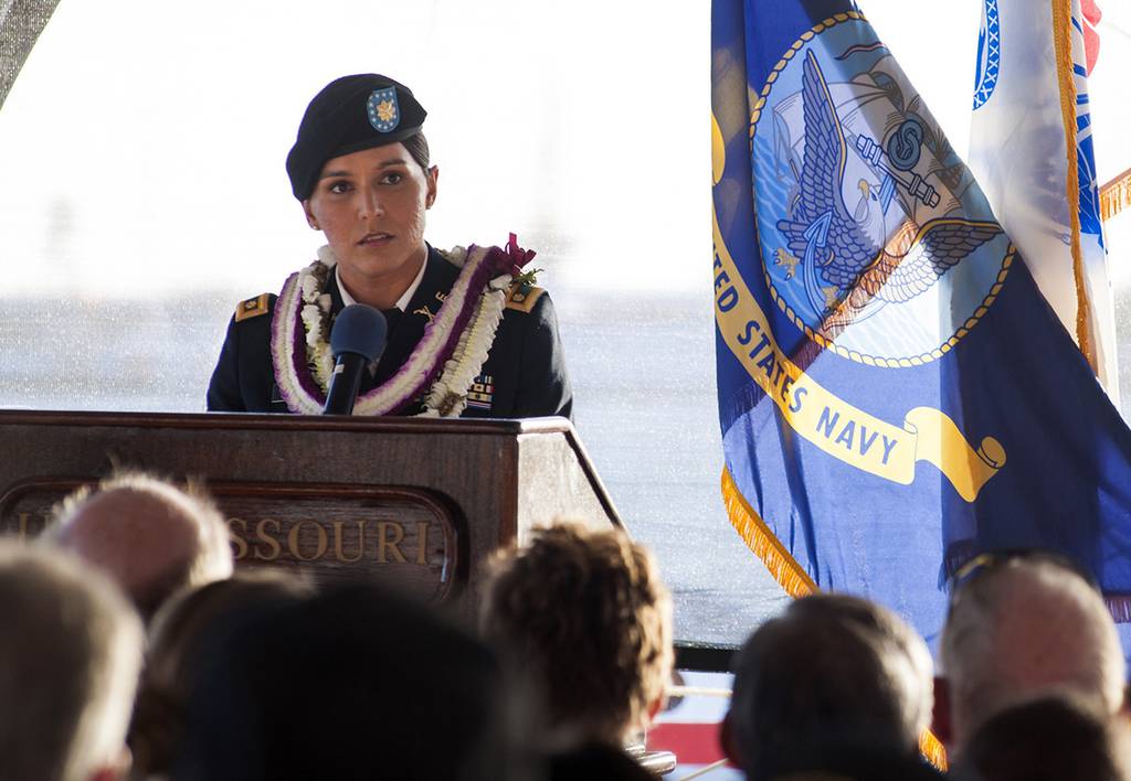 In this Nov. 11, 2015, photo, Maj. Tulsi Gabbard, Hawaii Army National Guardsman and U.S. House of Representative for Hawaii's 2nd District, delivers a keynote address during a Veterans Day ceremony aboard the Battleship Missouri Memorial at Pearl Harbor, Hawaii.