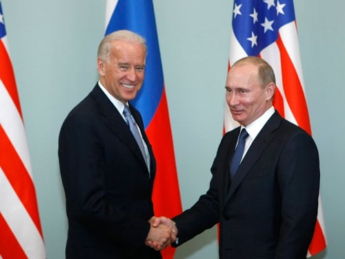 In this March 10, 2011, file photo, then-Vice President Joe Biden, left, shakes hands with Russian Prime Minister Vladimir Putin in Moscow. (Alexander Zemlianichenko/AP)