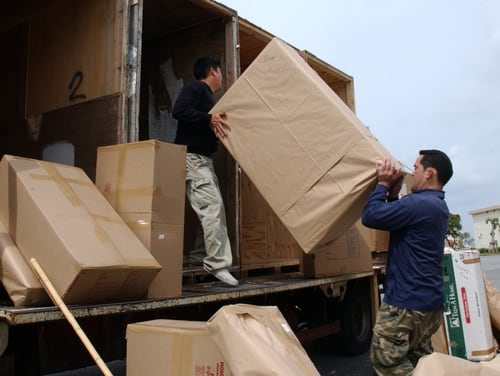 U.S. Transportation Command is moving toward contracting out the household goods process to a private company. In the short term this summer, more crates will be used for moves in the U.S. to better protect troops' household belongings. (Senior Airman Jeremy McGuffin/Air Force)