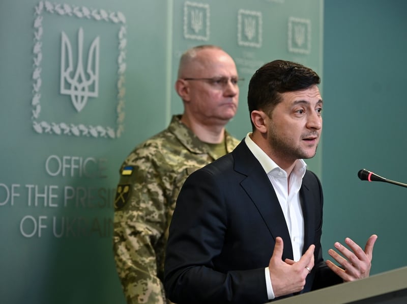 Ukrainian President Volodymyr Zelensky speaks flanked by Ruslan Khomchak, military commander of the Armed Forces of Ukraine, at a briefing following an outbreak of violence with pro-Russian separatists on the frontline, in Kiev on February 18, 2020. (Photo by GENYA SAVILOV/AFP via Getty Images)